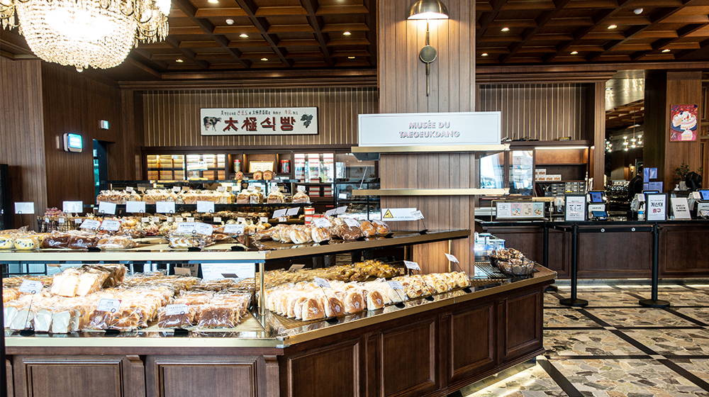 Interior of the cafe showing a bunch of breads and goodies on display for purchase