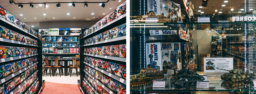 Left picture: An aisle of the store with models filling the shelves on both sides and a table at the end of the aisle with chairs to sit and build models; right picture: An up-close shot of the store window with different models and brands on display