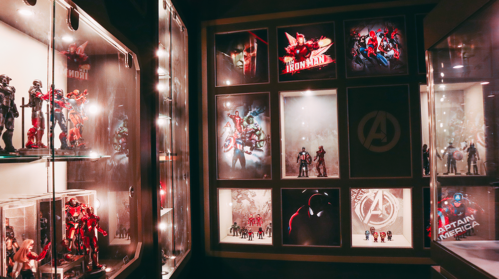 Store interior showing different display cases with Marvel characters, including Iron Man, Captain America, and more